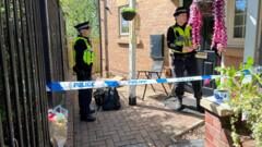 Four in court over murder of baby stabbed to death